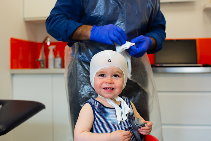 plagiocephaly-locband-lite-3d-printed-helmet-scanning-baby-smiling-3-lr